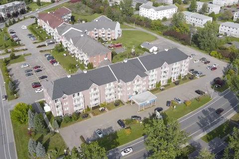 Aerial view of the residence buildings and parking areas.