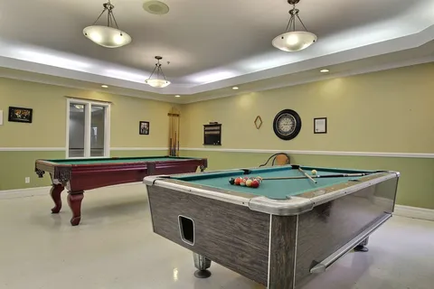 Games room with two billiard tables.