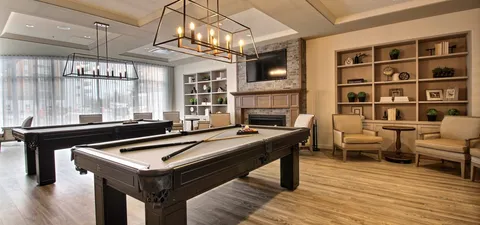 Billiard room with two pool tables.